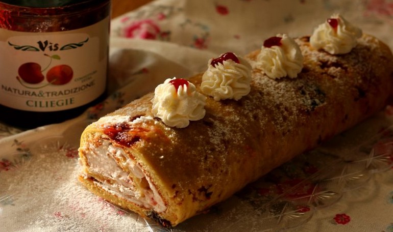 Cake roll with cherry jam and cream